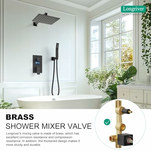 Modern bathroom with brass shower mixer valve and freestanding tub.