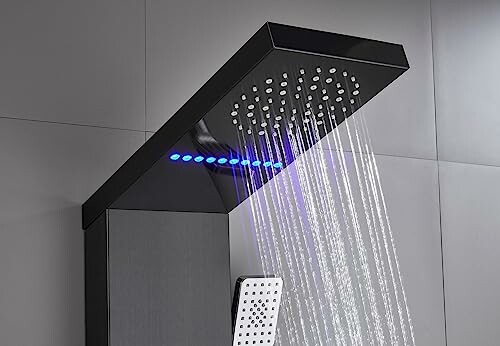 Modern shower head with LED lights and water spraying